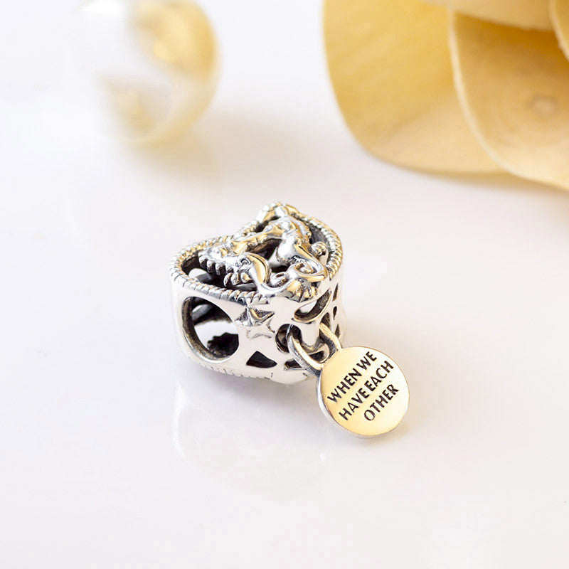 Hollow seahorse pattern heart charm