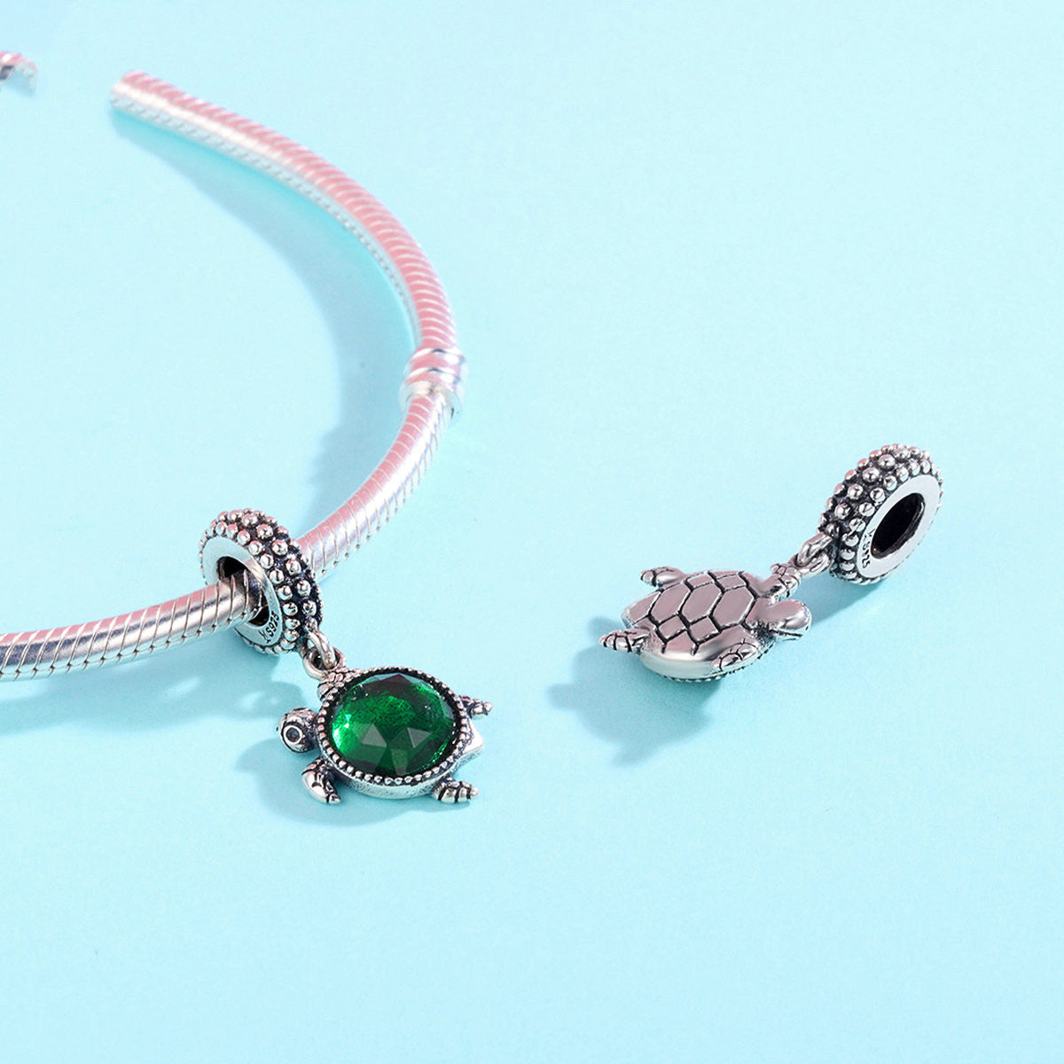 Turtle inlaid green crystal charm