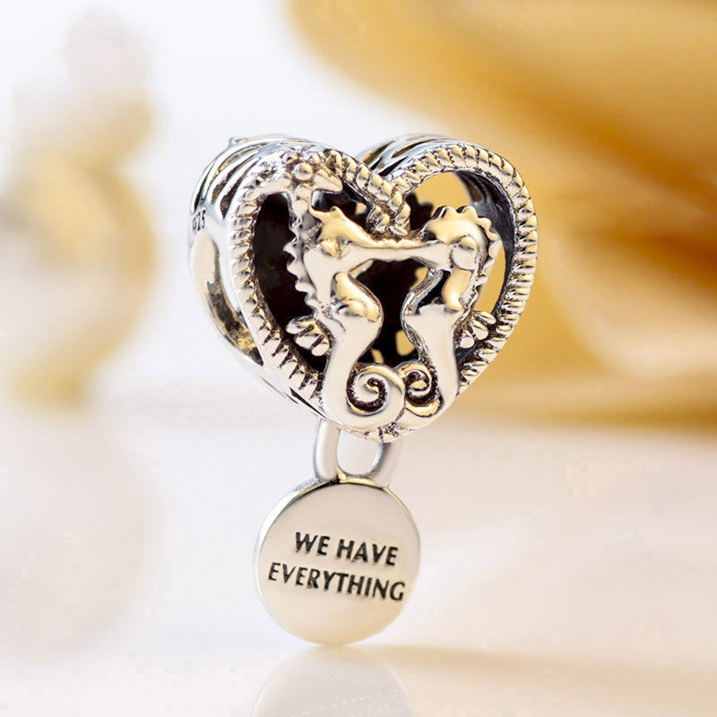 Hollow seahorse pattern heart charm