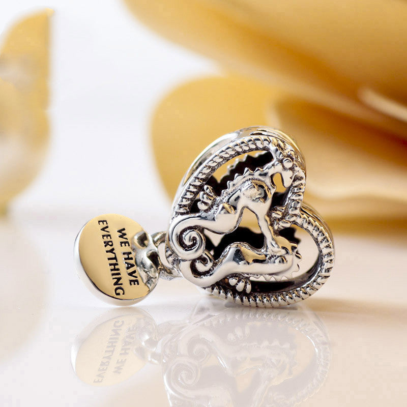 Hollow seahorse pattern heart charm